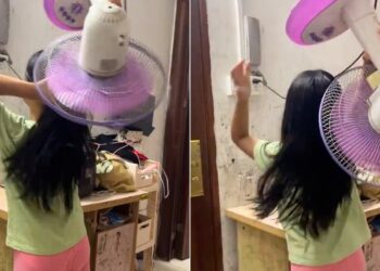 Girl Dries Hair With Fan