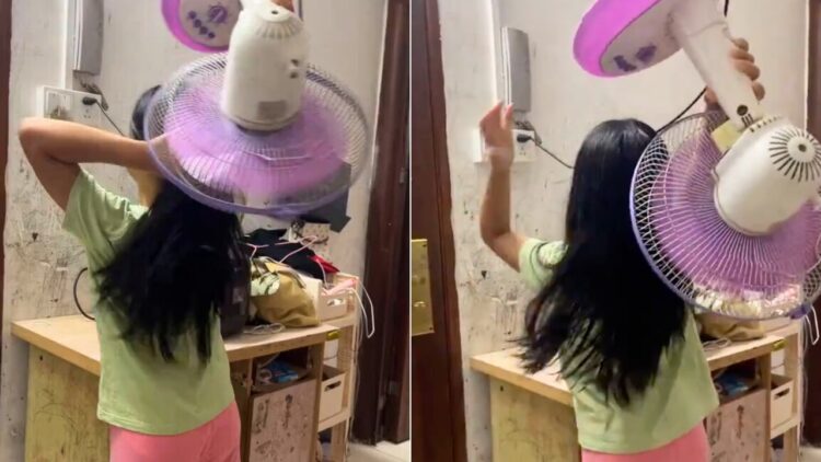 Girl Dries Hair With Fan